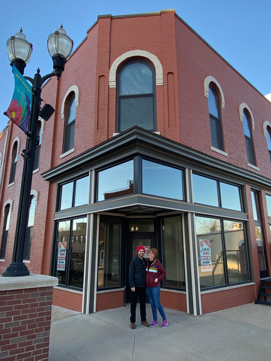 Kristin and Clancy outside the future location of Warm Wishes