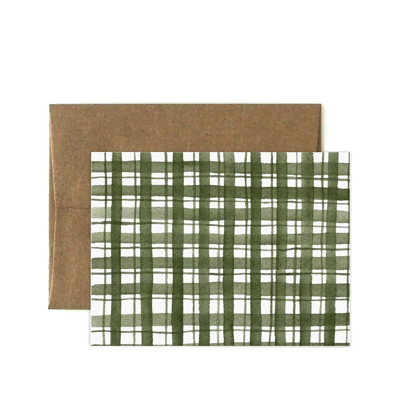Kraft paper envelope with green plaid patterned greeting card on a white background