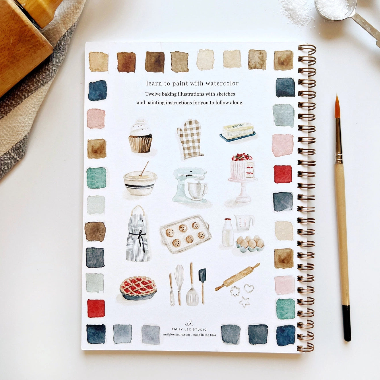 Back cover of watercolor workbook showing baking paintings