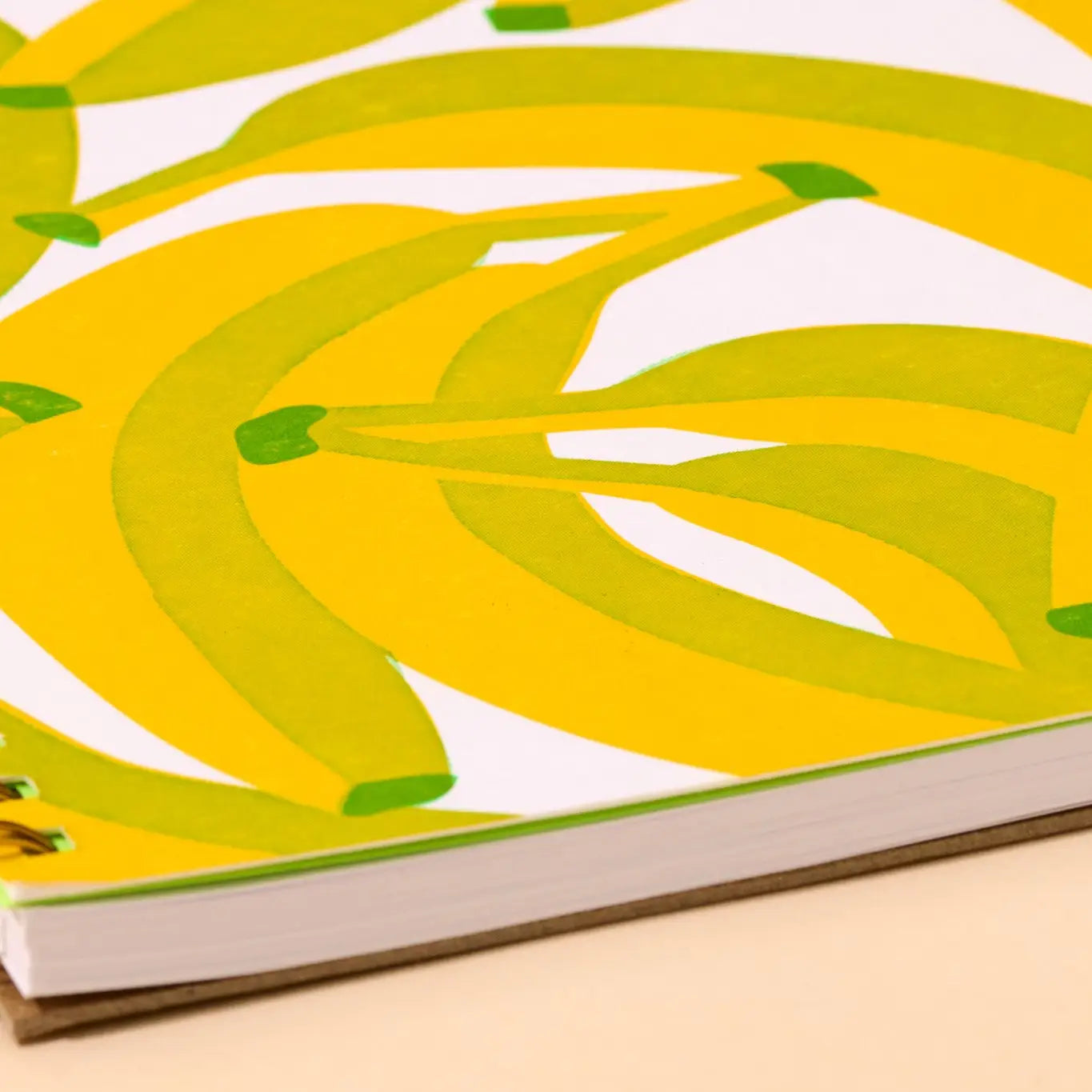 Notebook with a yellow banana pattern on a white background
