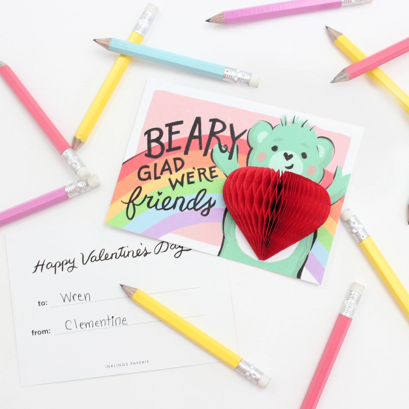 Bear valentine with pencils around it
