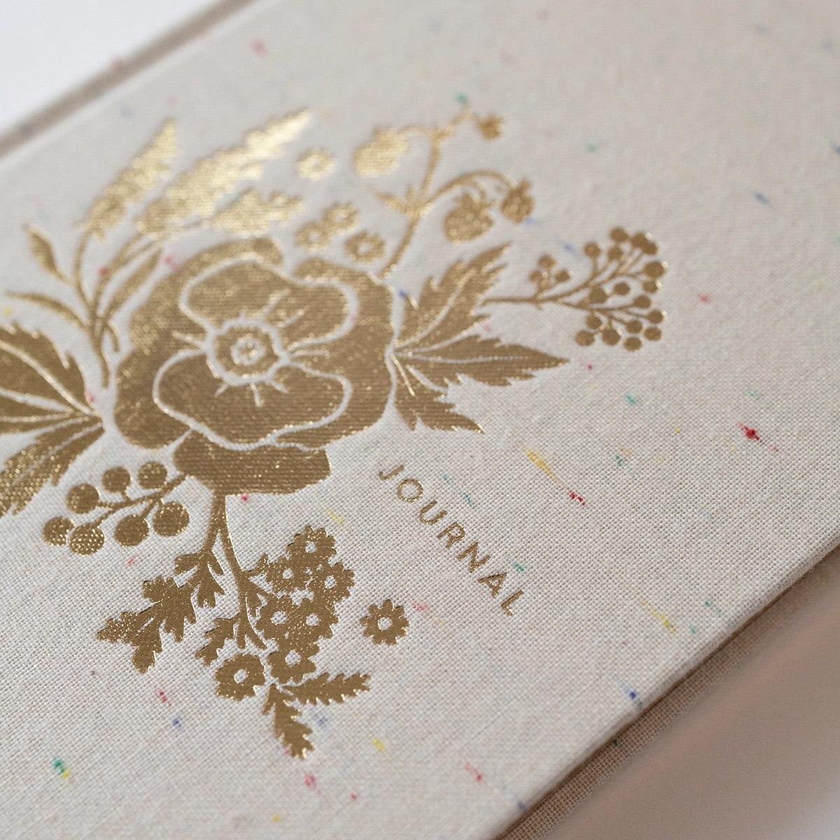 Zoomed in view of gold foil floral patter