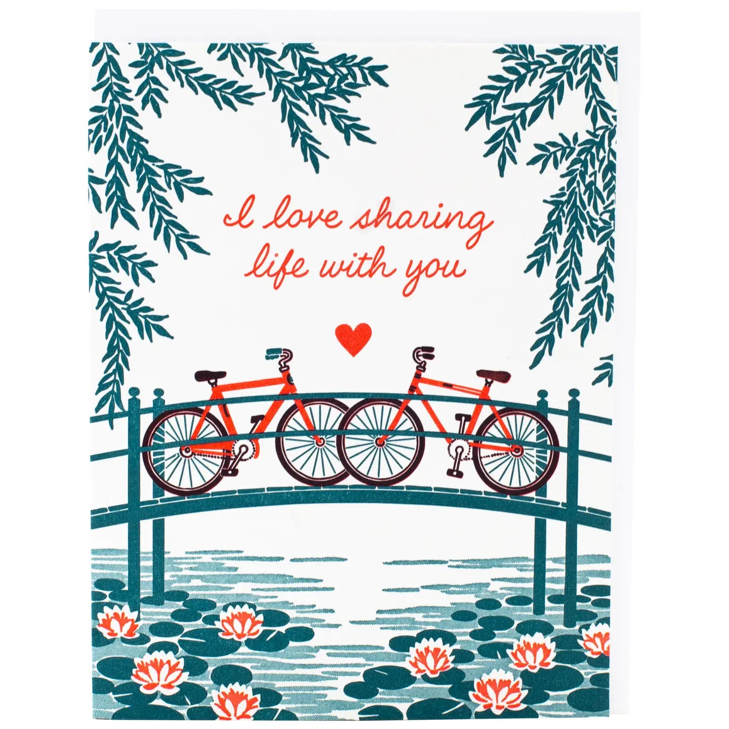 White greeting card with an illustration of two bikes on a bridge. Red text: I love sharing life with you