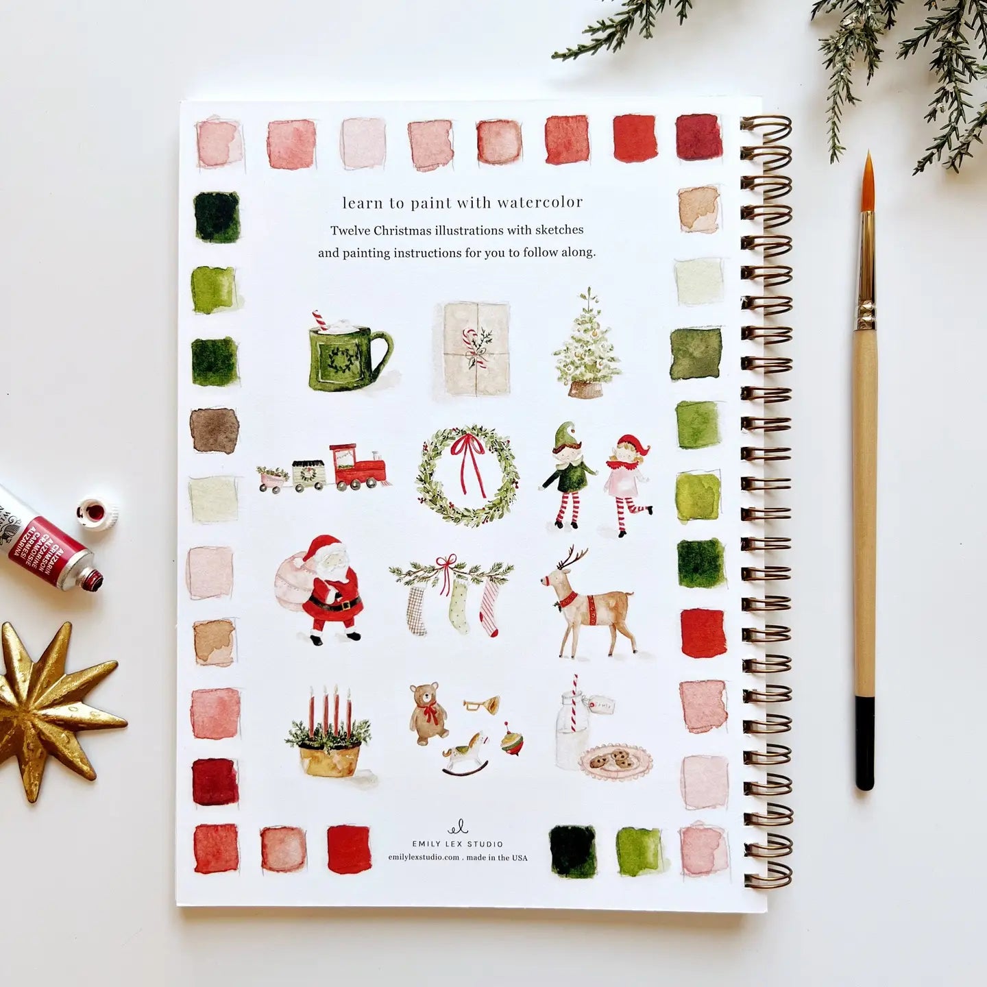 Spiral-bound book with 12 Christmas illustrations on back cover