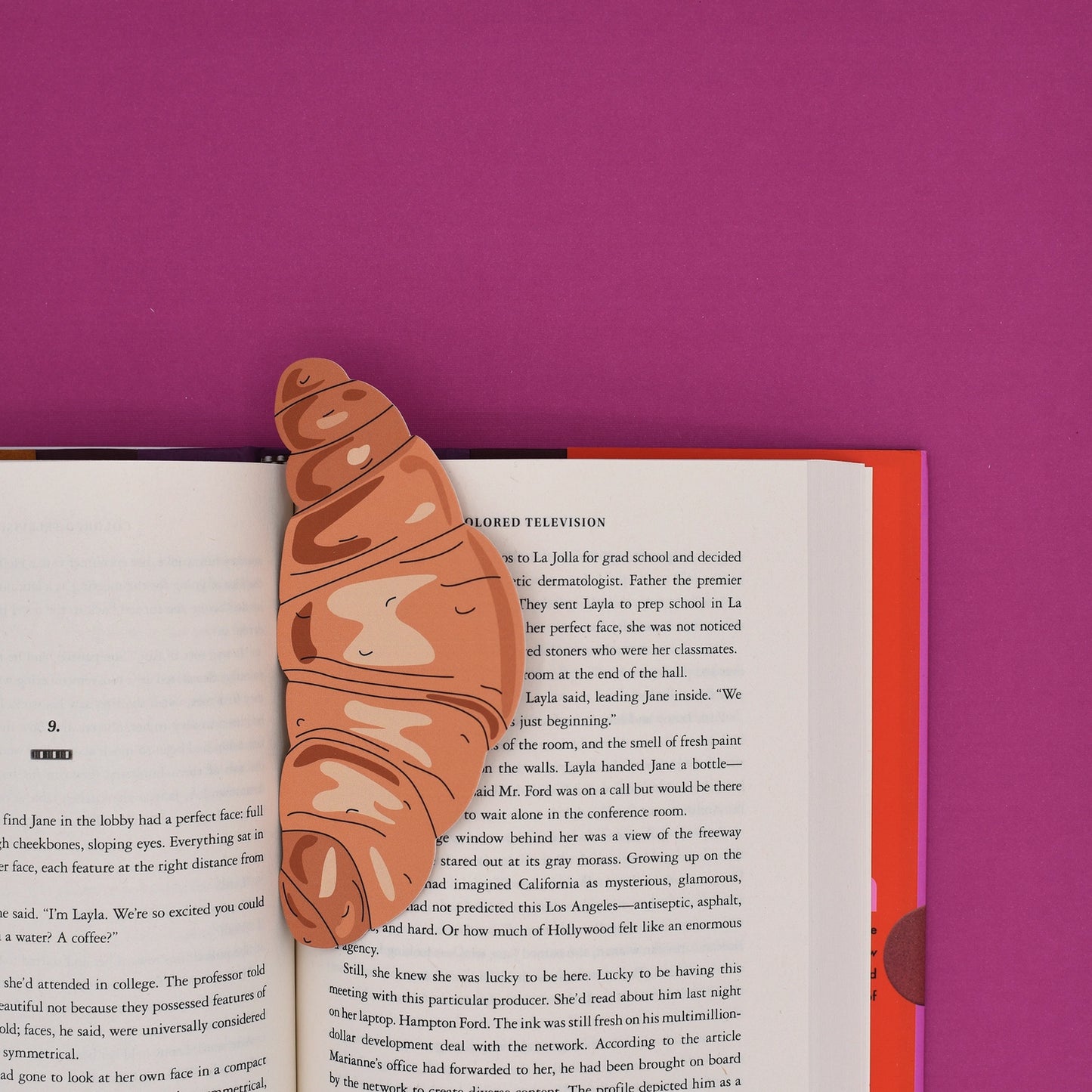 Croissant bookmark in a book