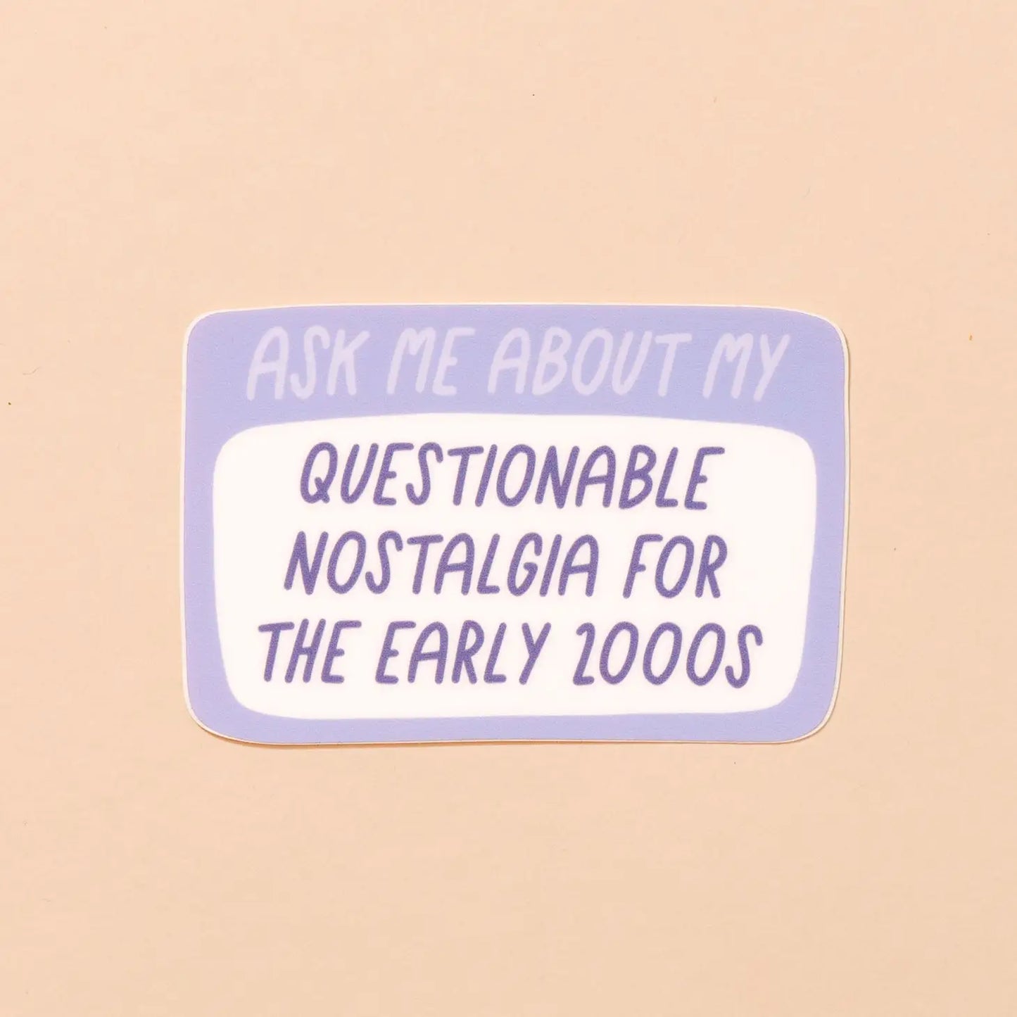 Rectangle-shaped sticker. Purple and white background. Text reads "ask me about my questionable nostalgia for the early 2000s"