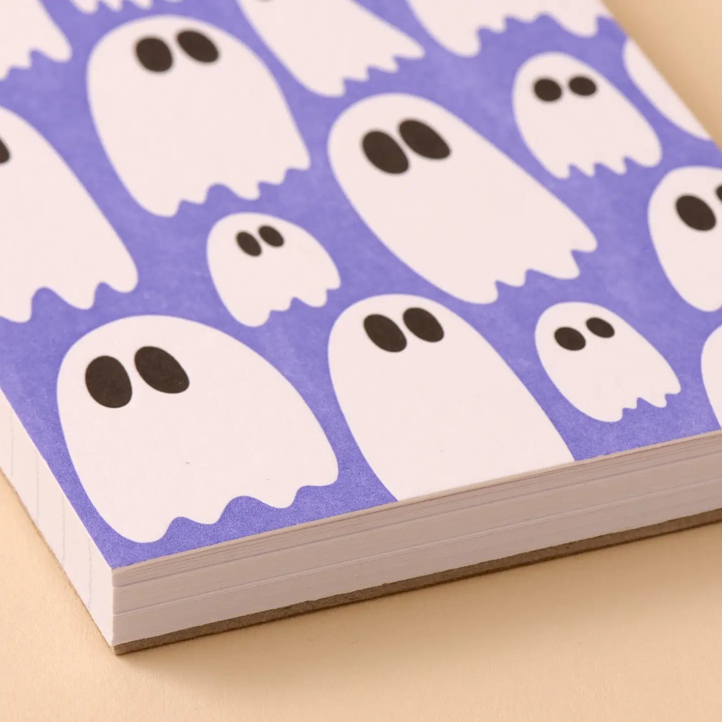 Purple notebook with ghost pattern