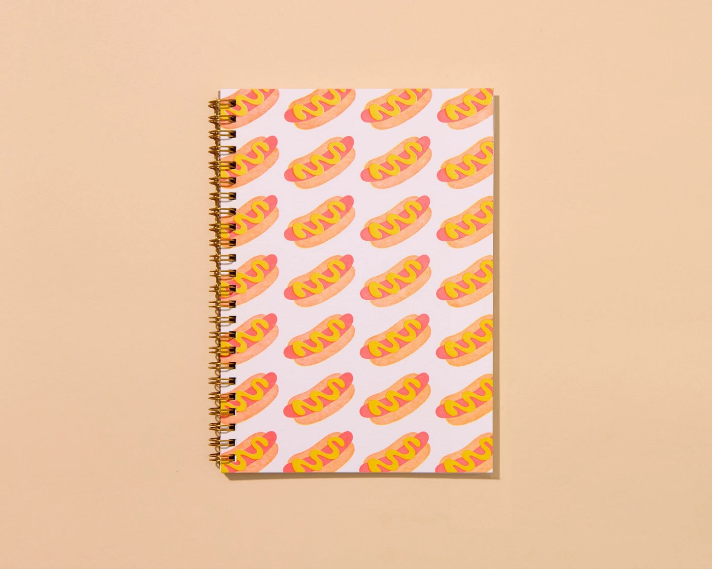 Front cover of a spiral notebook. Repeating hot dog pattern