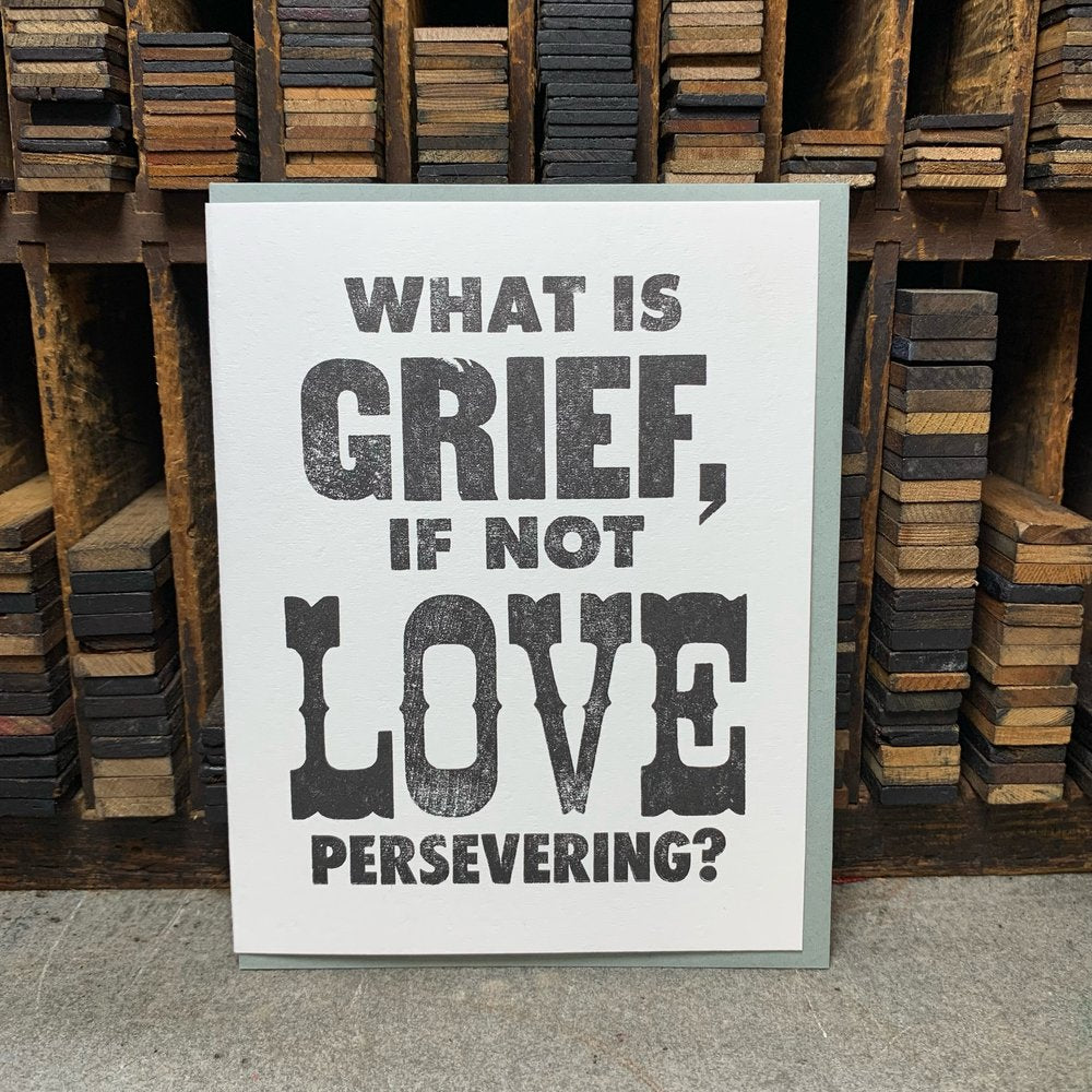 White greeting card with black text: what is grief, if not love persevering?
