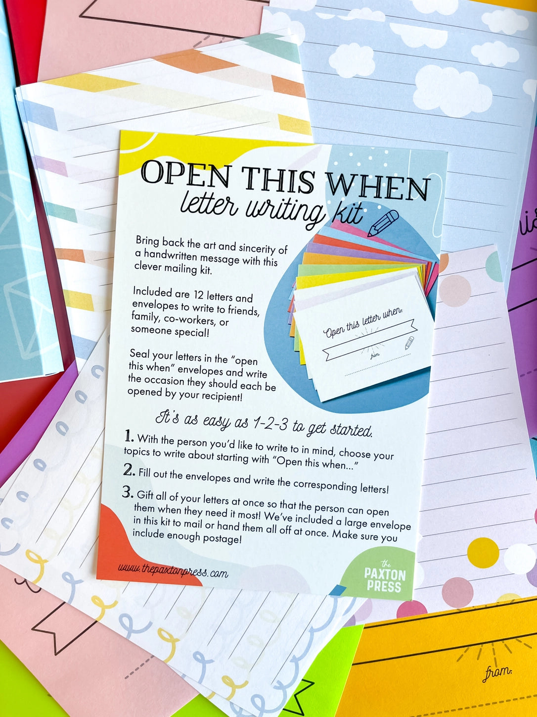 Letter writing kit with colorful envelopes and instructions on a multicolored background