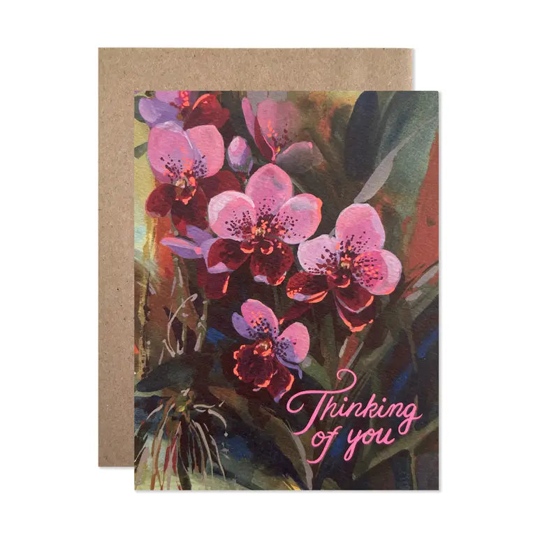 Greeting card with pink flowers and 'Thinking of you' text on a kraft envelope.