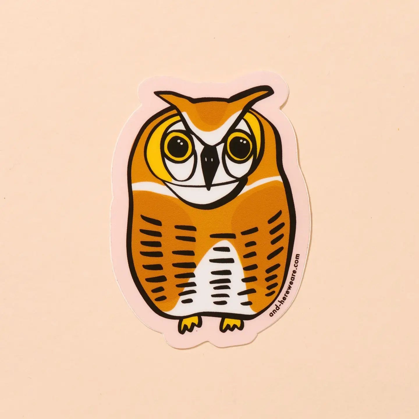 Die-cut sticker in the shape of an owl. Orange, yellow, white color.