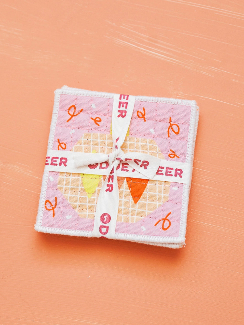 Coasters stacked and tied in ribbon