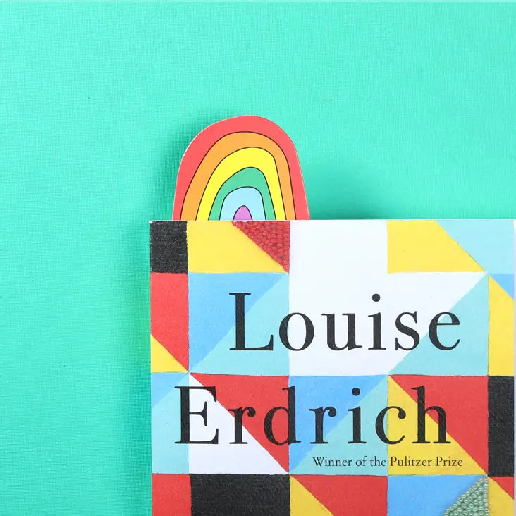 Rainbow bookmark sticking out of a book