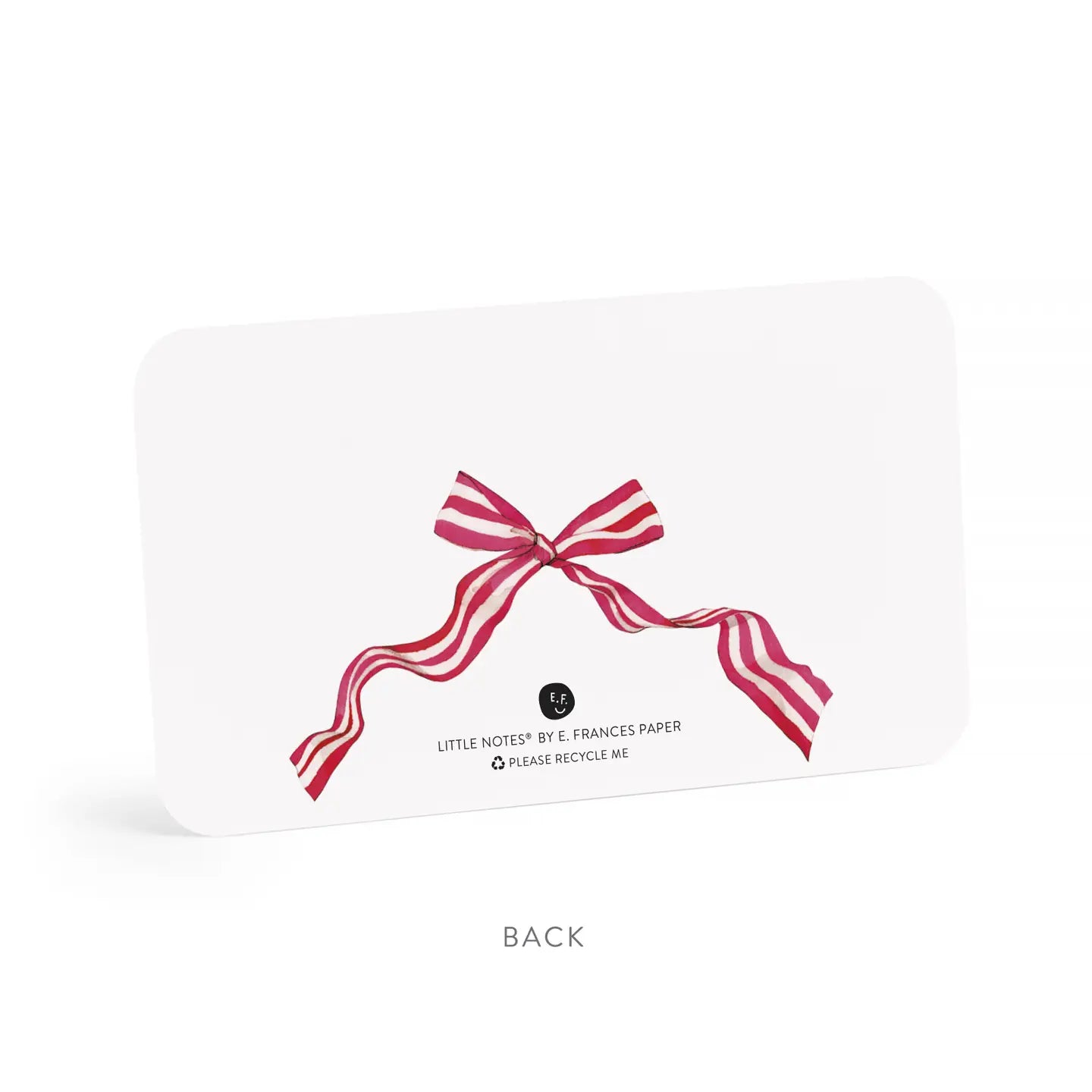 White card with a red and white striped bow on a white background