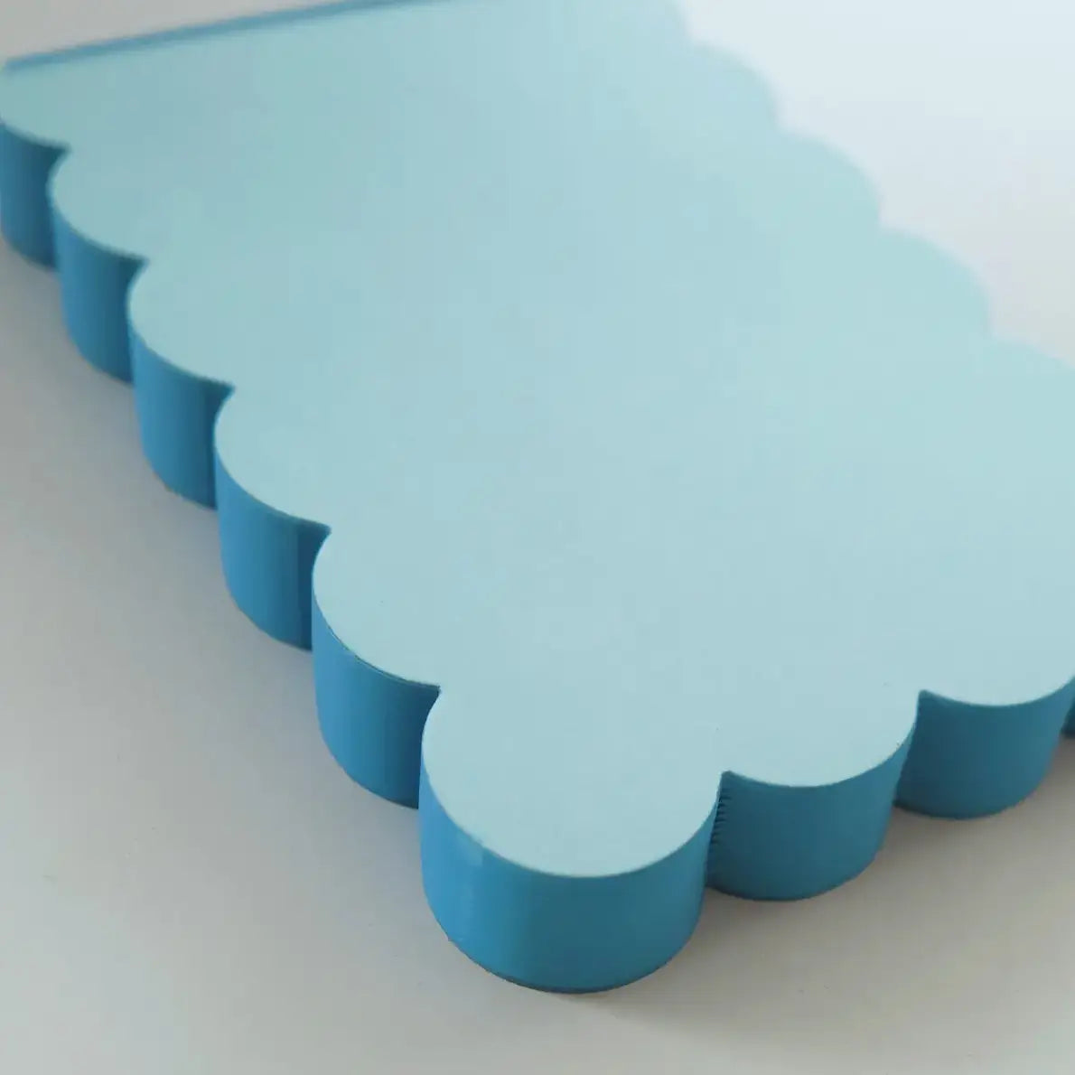 Blue scalloped-edge notepad
