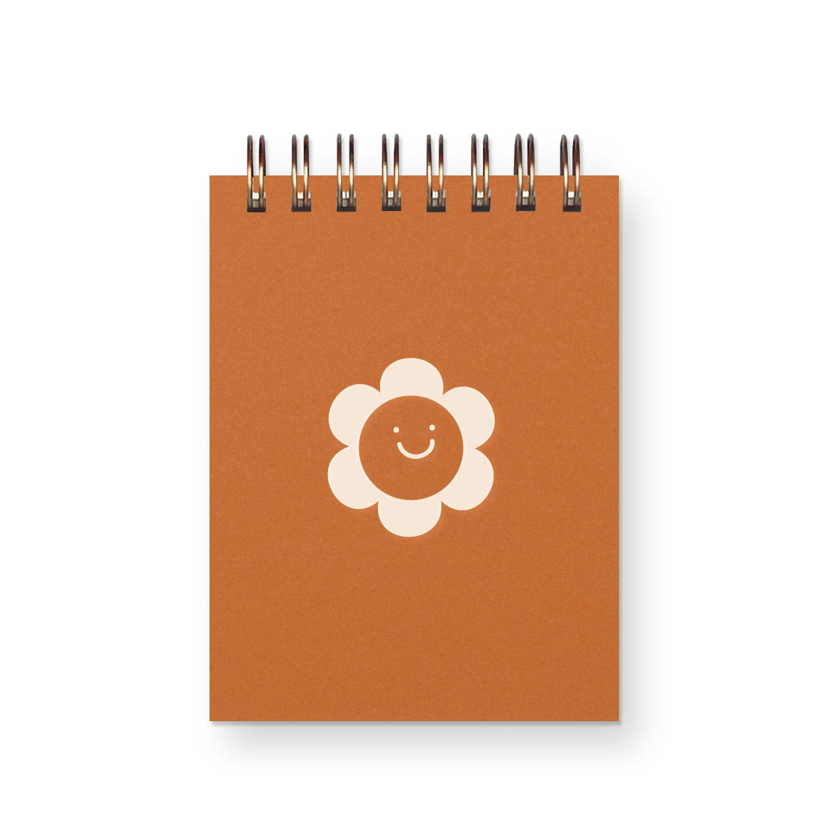 Small orange notebook with daisy illustration