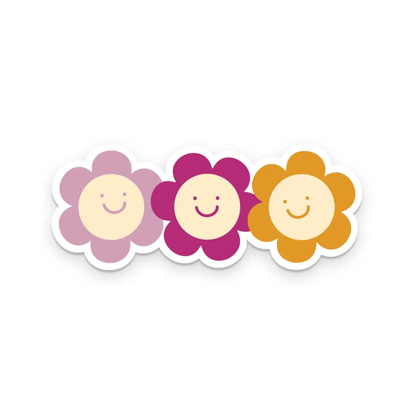 Die-cut sticker of three flowers with smiley faces. Purple, pink, and mustard colored.