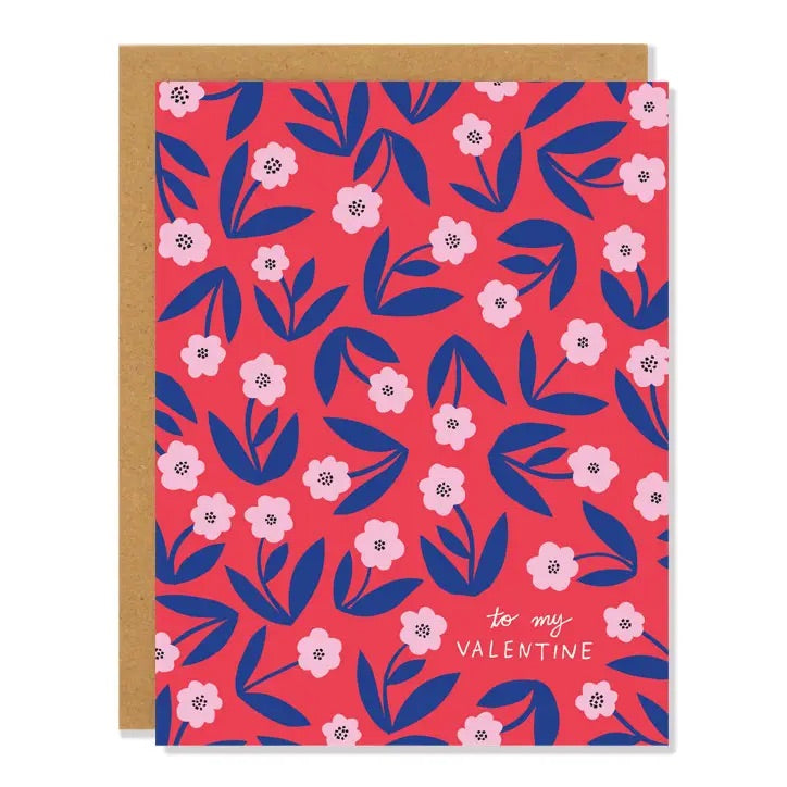 White card with full color reddish pink background. Illustrations of blue and pink flowers. White text “to my Valentine”