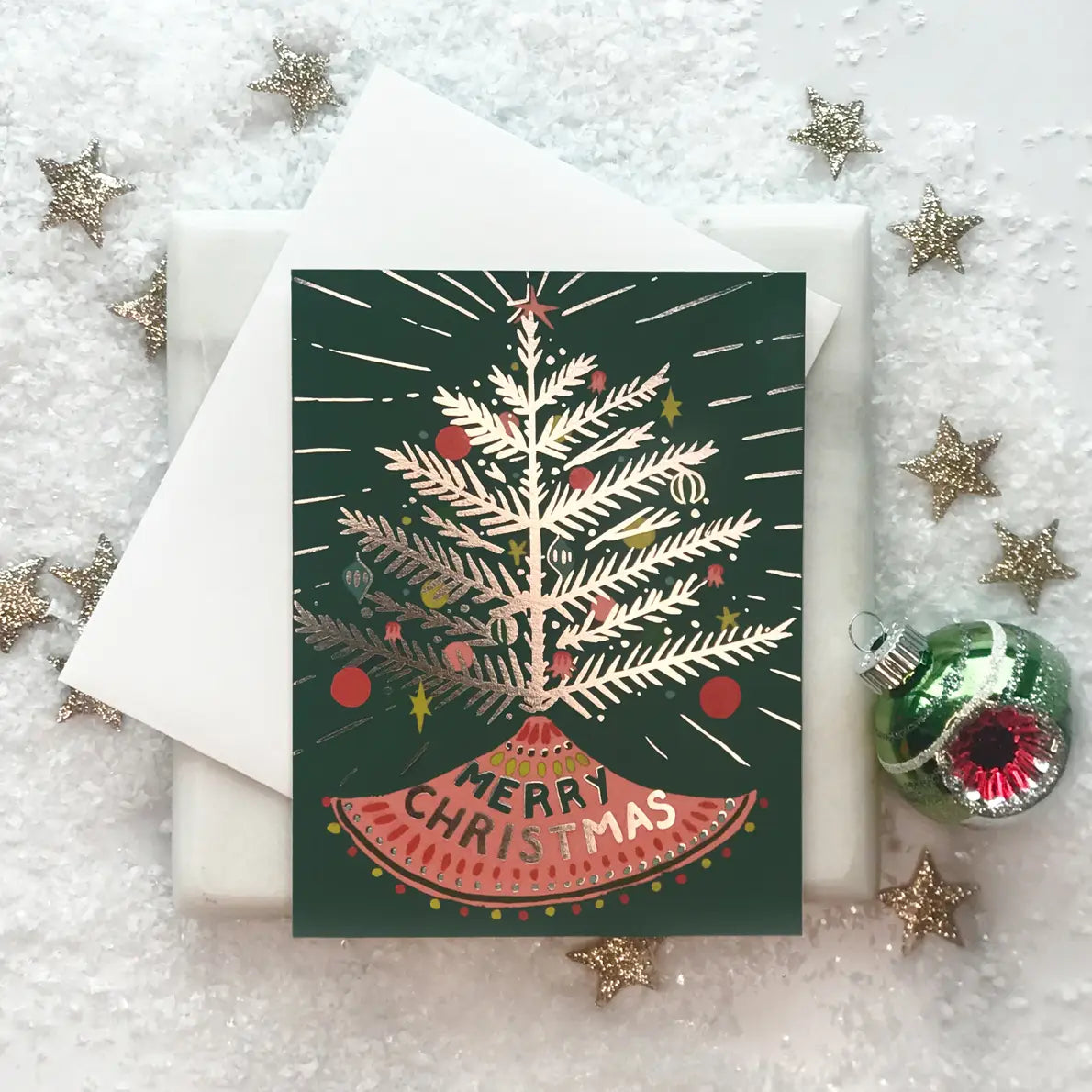 A greeting card with a vintage Christmas tree design.