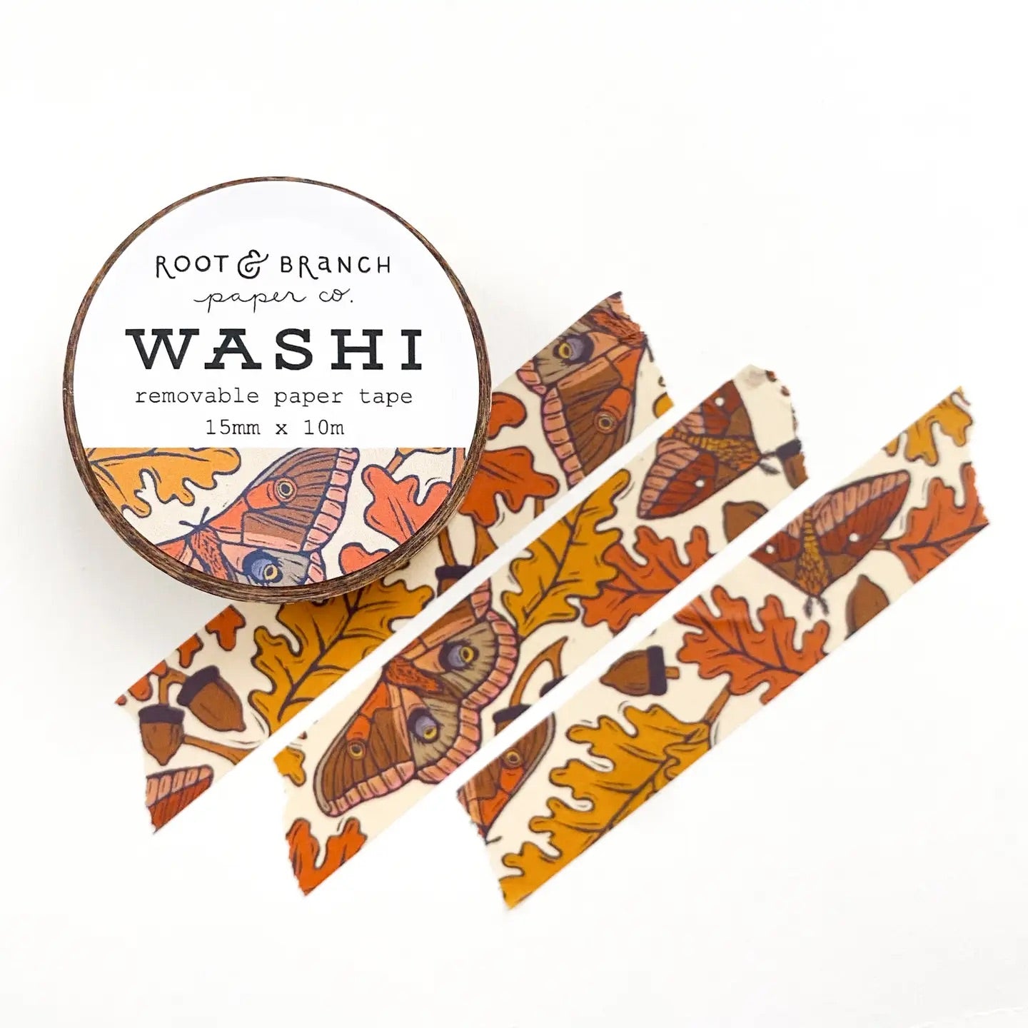 Front cover of Washi tape roll and three pieces of tape. Tape is autumnal colors and has a white oak/moth pattern