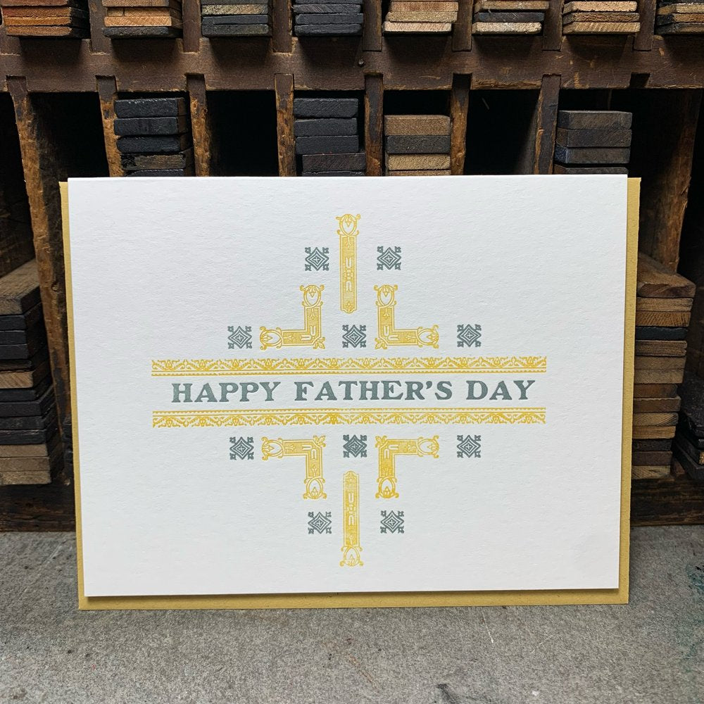 White card with yellow and grey design letterpress printed into the card. "Happy Father's Day" in grey ink.
