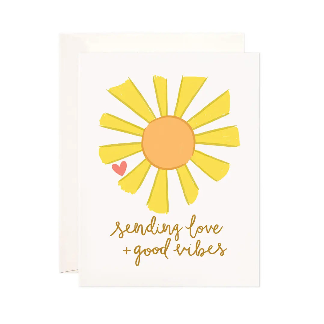 White card with a yellow and orange sun. Brown text reads "sending love and good vibes"