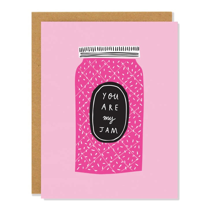 White greeting card with pink background and darker pink jar of jam. Black label with white text reads "you are my jam." Inside of card is white.