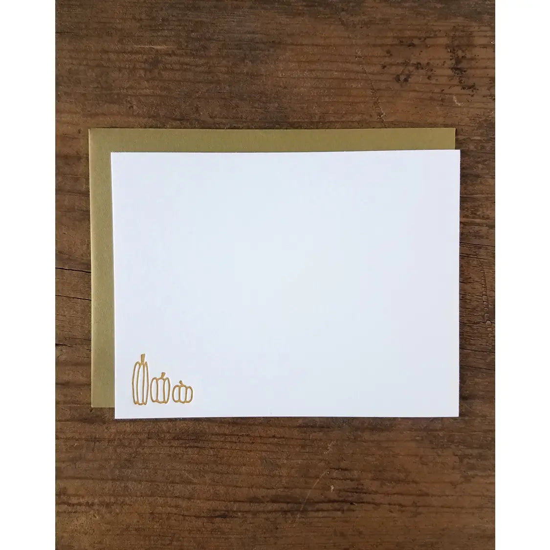 White notecard with orange-brown pumpkins in the lower left corner