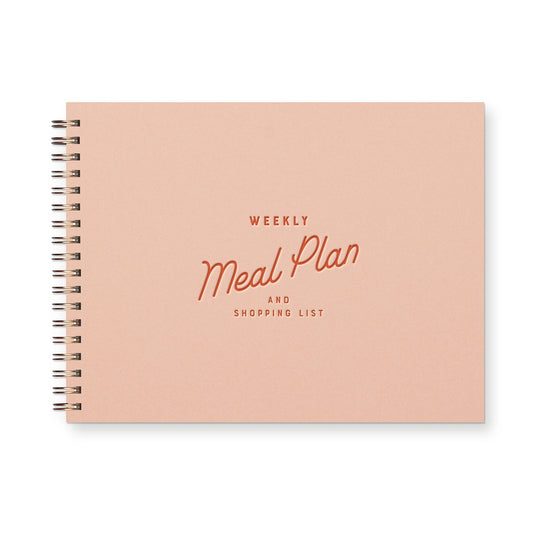 Front cover of spiral-bound meal planner. Light pink cover with red text letterpress printed into cover. Text reads "Weekly Meal Plan and shopping list" 