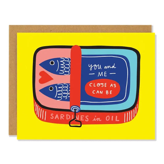 White card with full color yellow background. Illustration of sardine tin can. Text “you and me as close as can be”