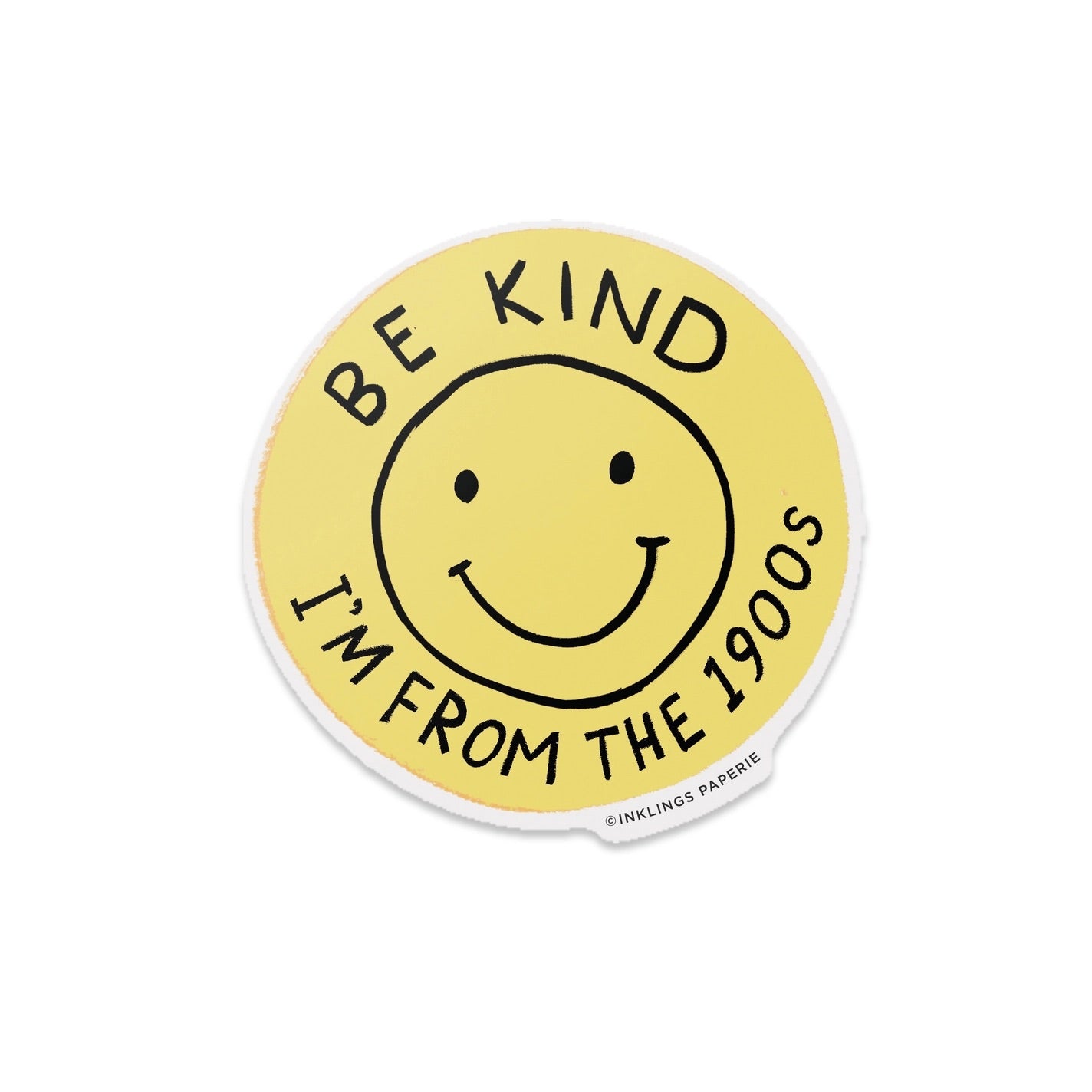 Yellow circle sticker with a black smiley face. Black text "be kind I'm from the 1900s" 
