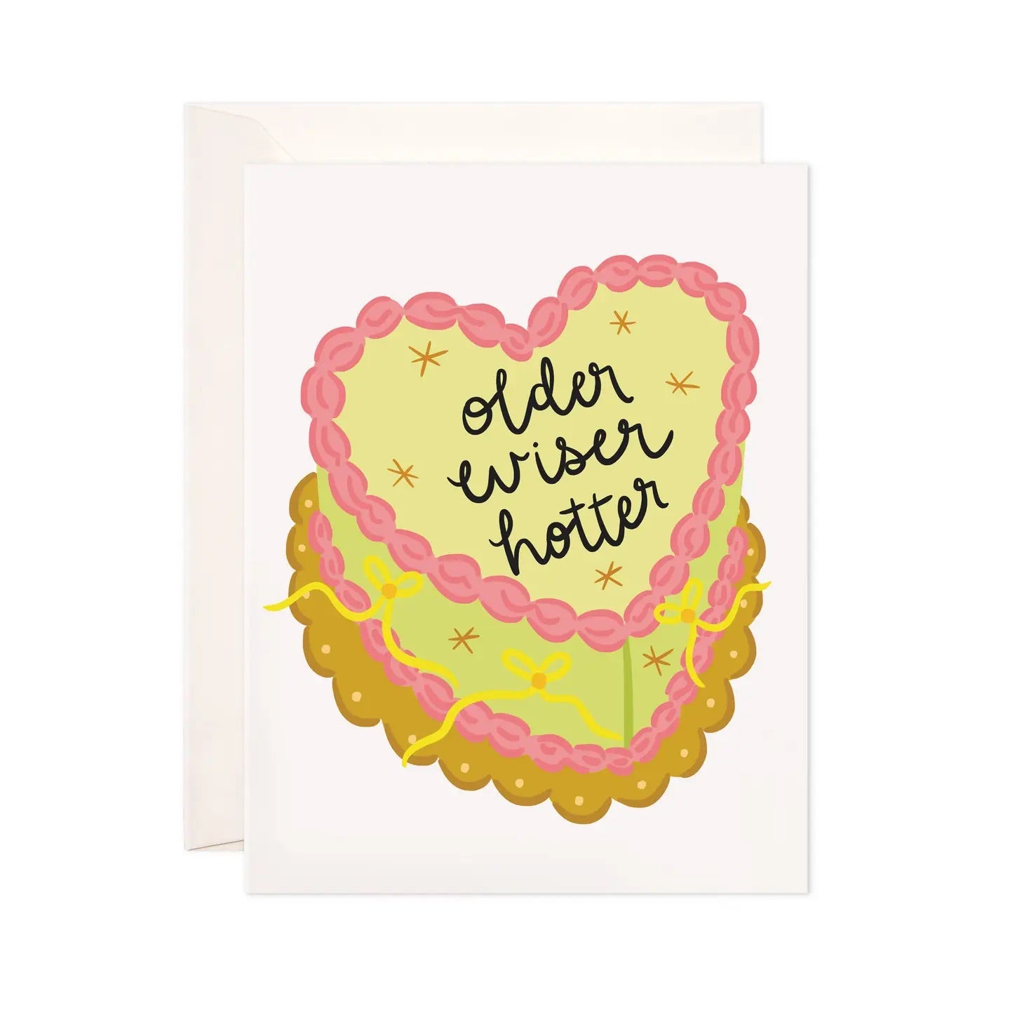 White greeting card with pink and green birthday cake. Black text on cake reads “older wiser hotter” 