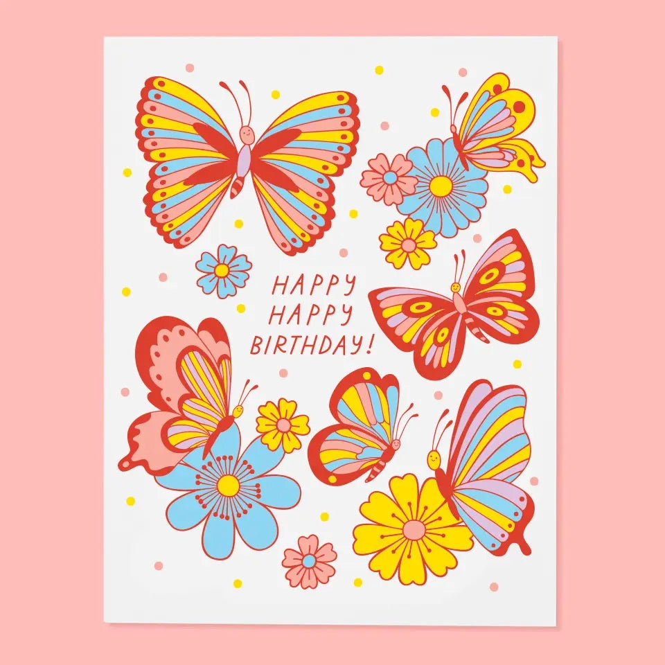 White greeting card with yellow, blue, and red butterfly illustrations. Red text “happy happy birthday!” 