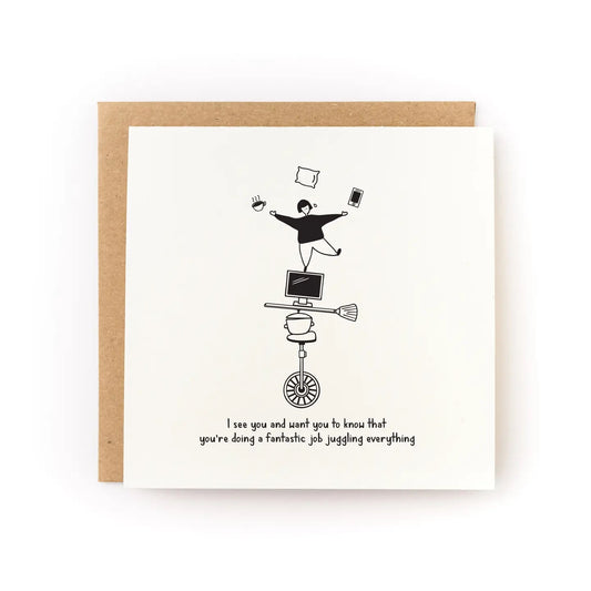 White card with black illustration of person balancing on a unicycle, broom, and computer monitor while juggling. "I see you and want you to know that you're doing a fantastic job juggling everything" in black text. 