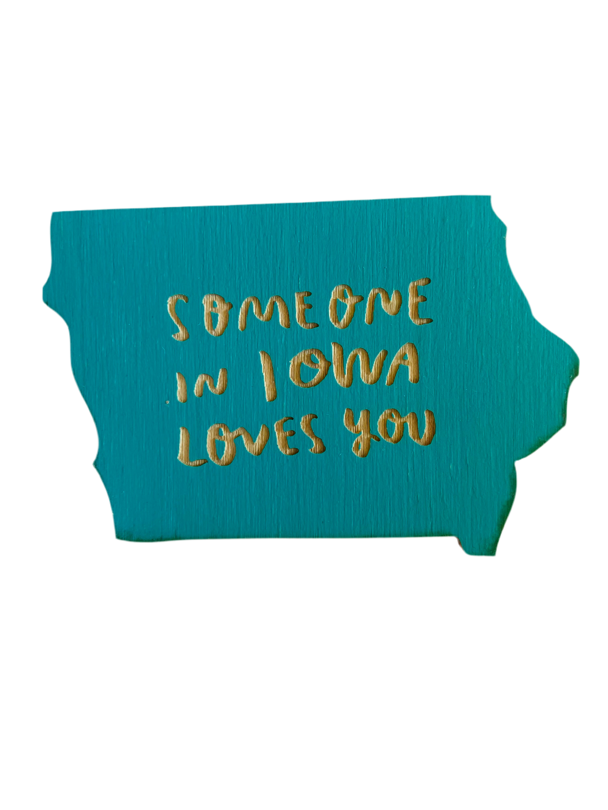 Iowa shaped turquoise magnet. Laser cut into the magnet is the text “someone in Iowa loves you” 