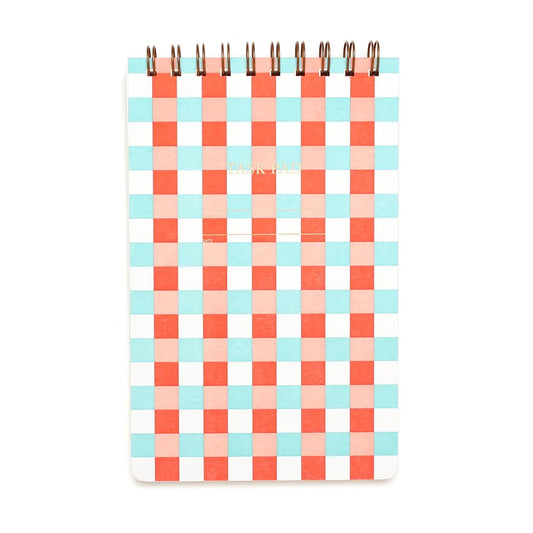 Top-spiral notebook. Red and turqouise checkerboard patterned cover. 