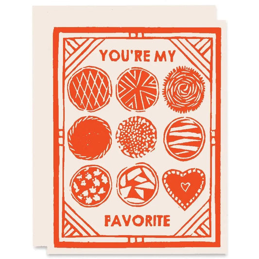 Greeting card with white background and orange border. Orange and white pie illustrations. Orange text "you're my favorite" 