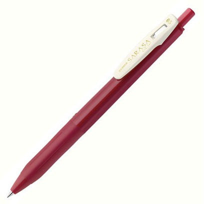 Retractable red pen with a red barrel and cream-colored clip. 