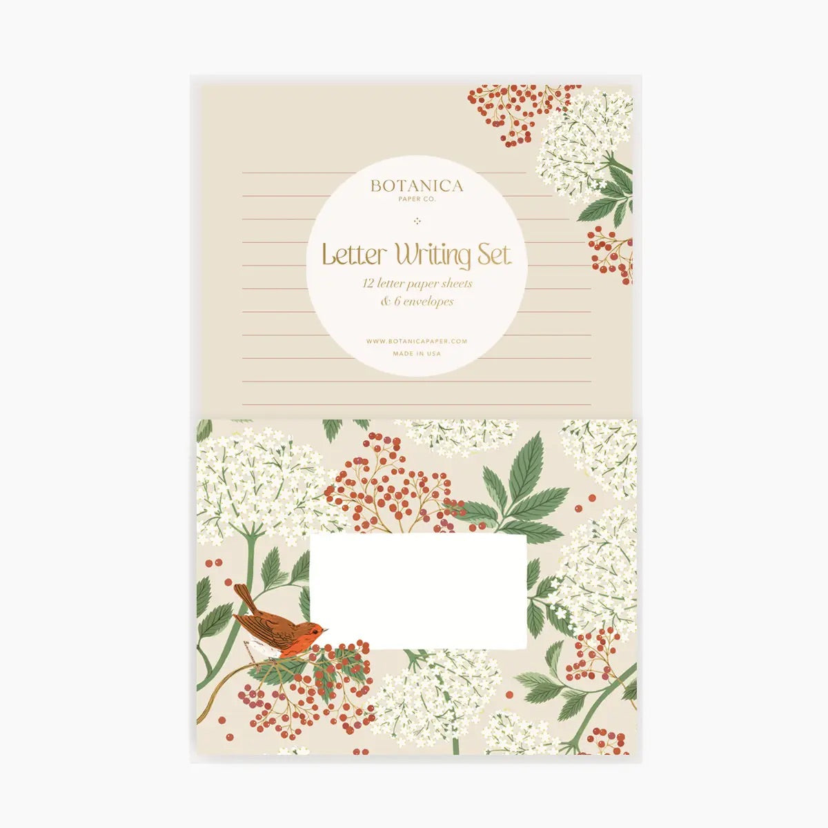 Front view of letter writing set. Lined cream paper with a red and green floral border. Cream envelope with red and green floral border. 