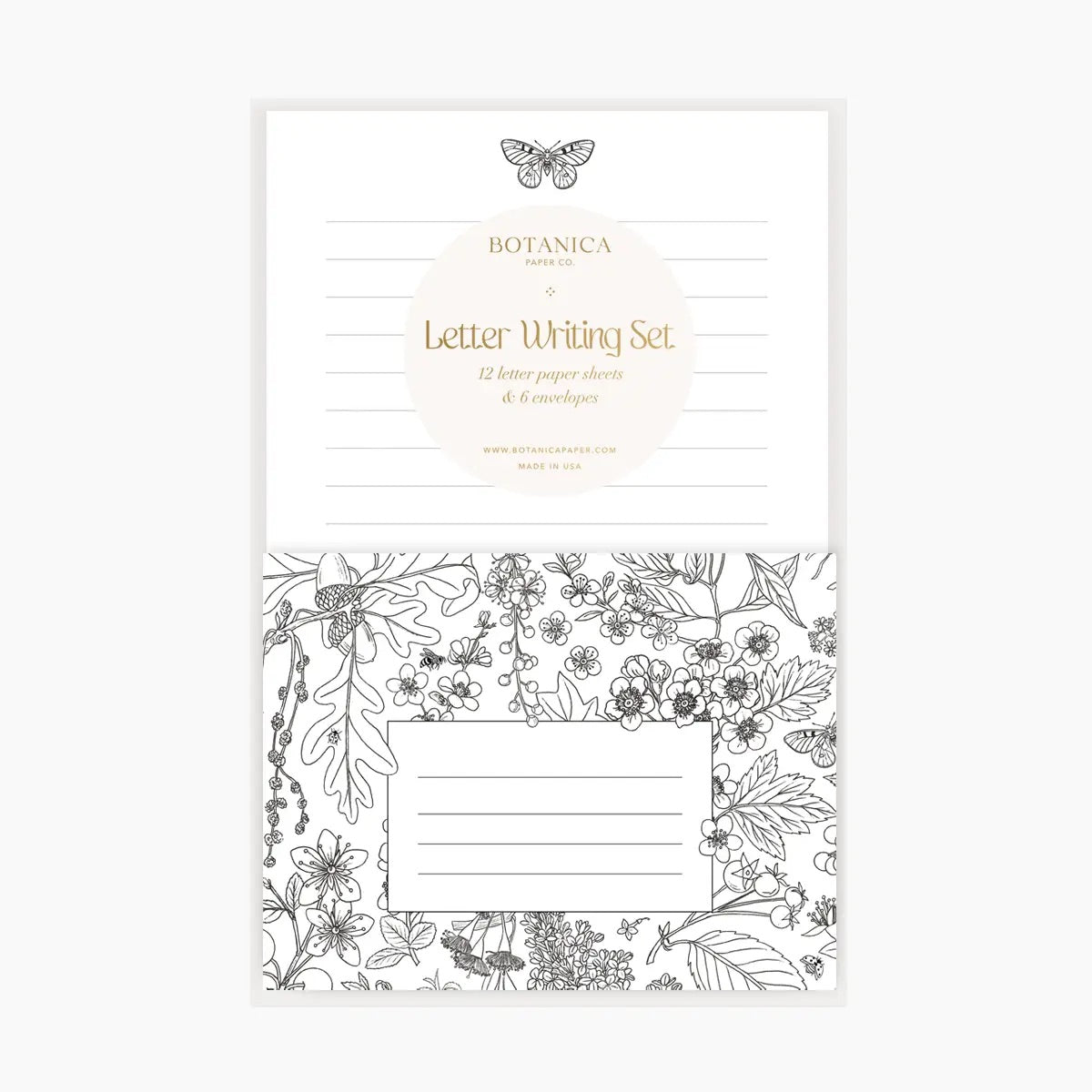 Front view of letter writing set. Lined white paper with a black and white butterfly at the top. Black and white floral envelope.