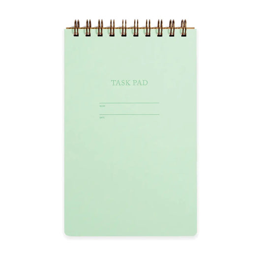 Top-spiral notebook with mint green cover. 