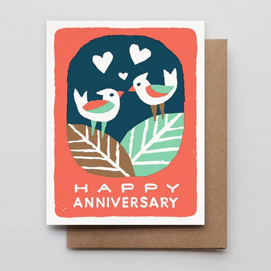 White card with coral background and illustration of two birds. White text “happy anniversary” 