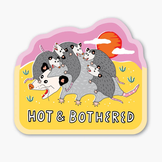 Die-cut sticker of baby possums climbing on an adult possum. White text “hot and bothered” 