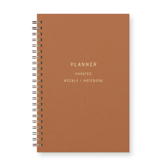 Front cover of spiral bound planner. Copper color 