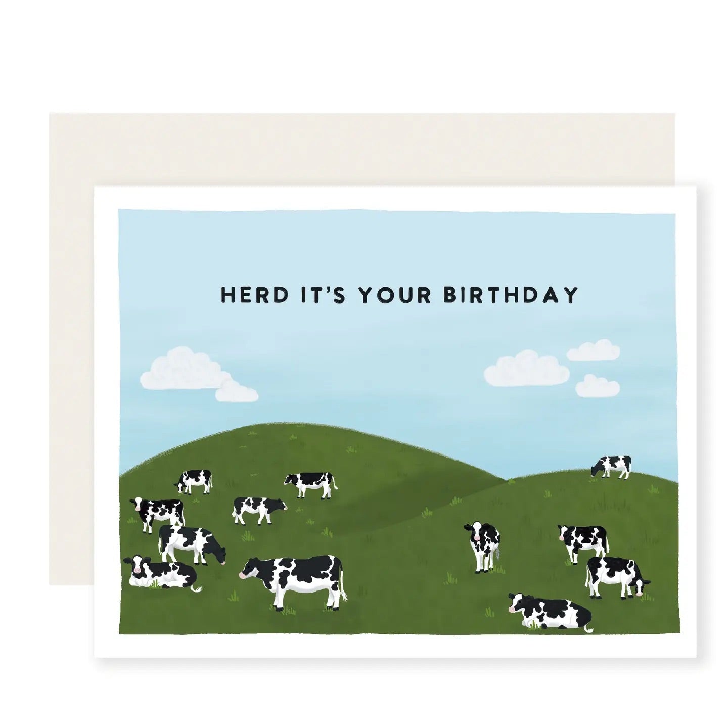 White card with illustration of cows in a green hilly field under a blue sky. Black text “herd it’s your birthday” 