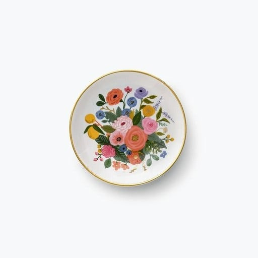 Small white plate with gold rim. Multicolor floral design 