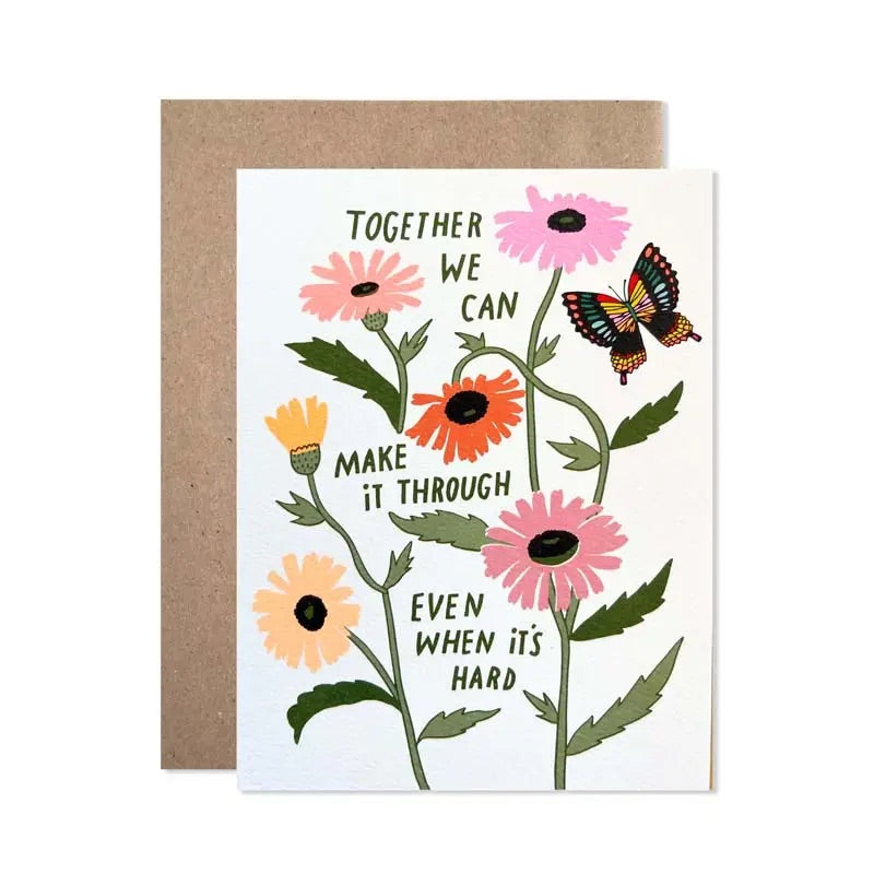 White card with multicolor floral design. Dark green text "together we can make it through even when it's hard" 