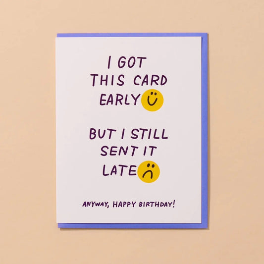 White card with two yellow smiley face illustrations. Blue text reads “I got this card early but I still sent it late. Anyway, Happy birthday!” 