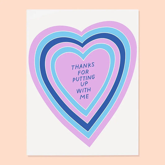 White greeting with blue and purple heart illustration. Blue text “thanks for putting up with me” 